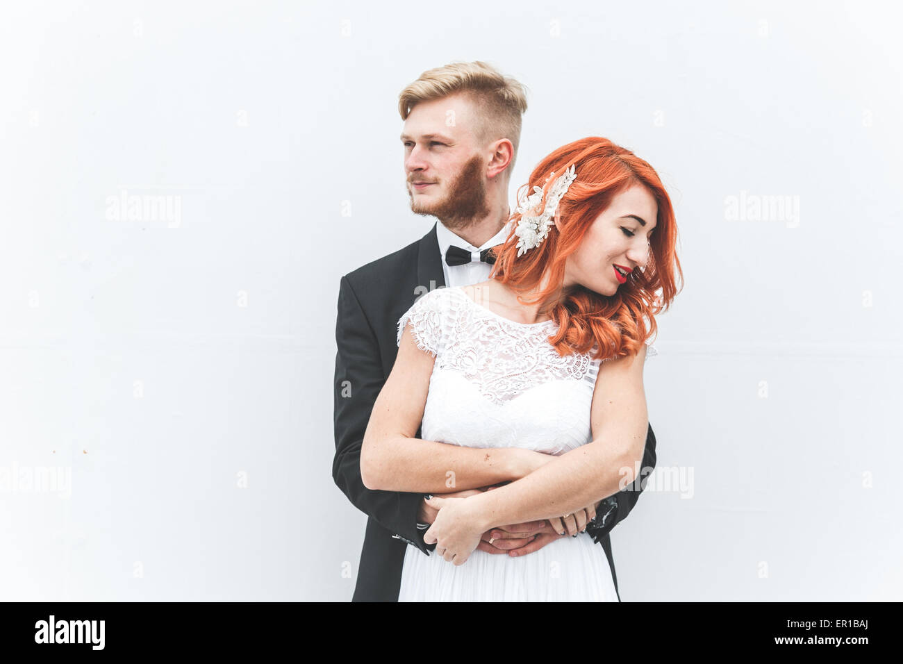 Wedding couple on a background of whitewall Stock Photo - Alamy