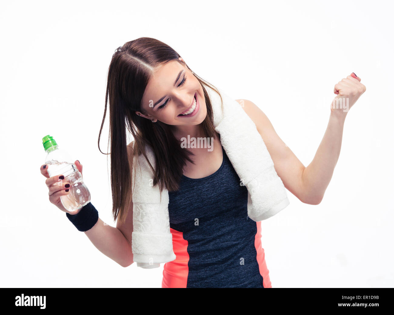 Happy fitness woman with towe and bottle of water celebrating her ...