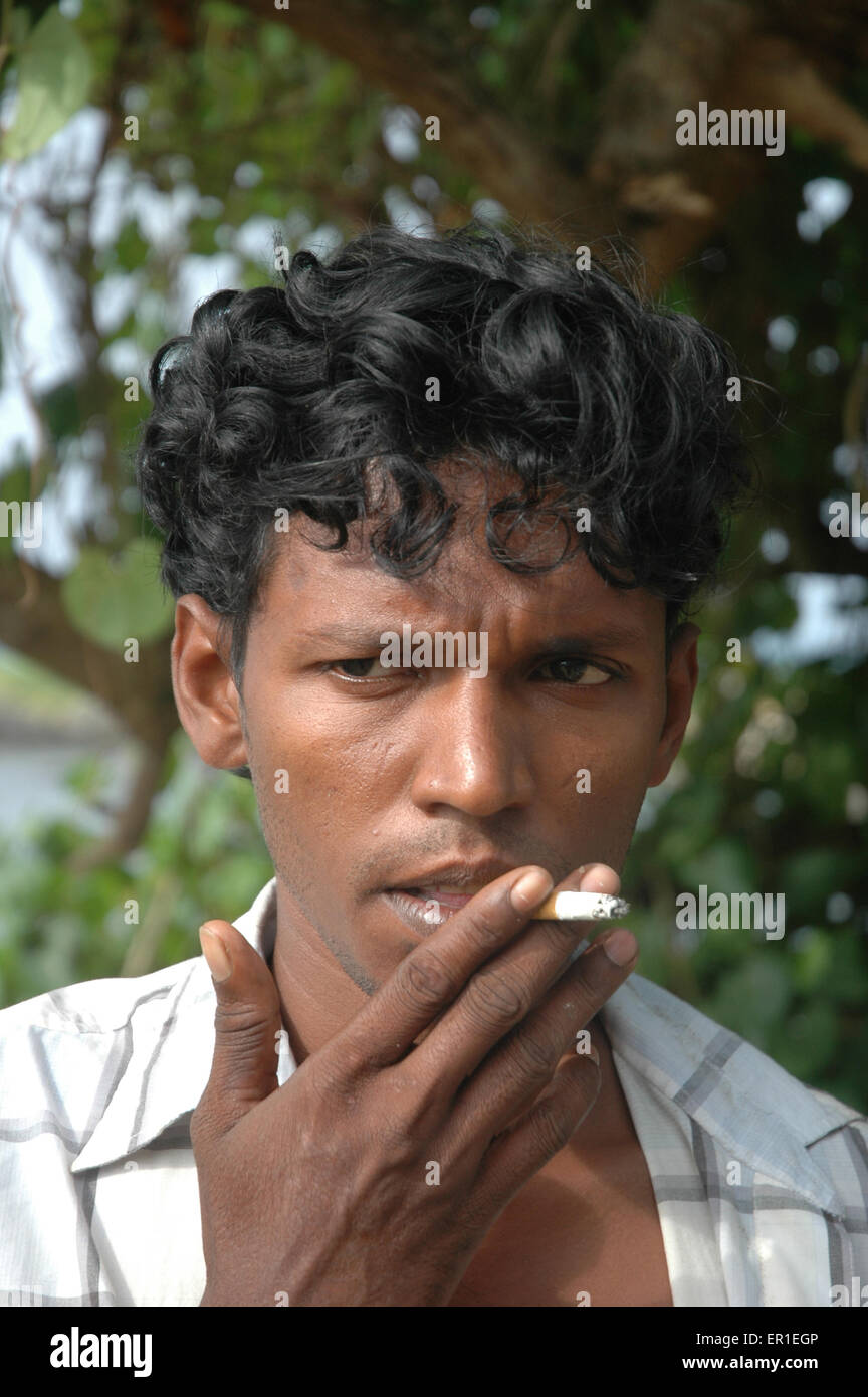 Ahangama, Sri Lanka a man smoking a cigarette Stock Photo Alamy