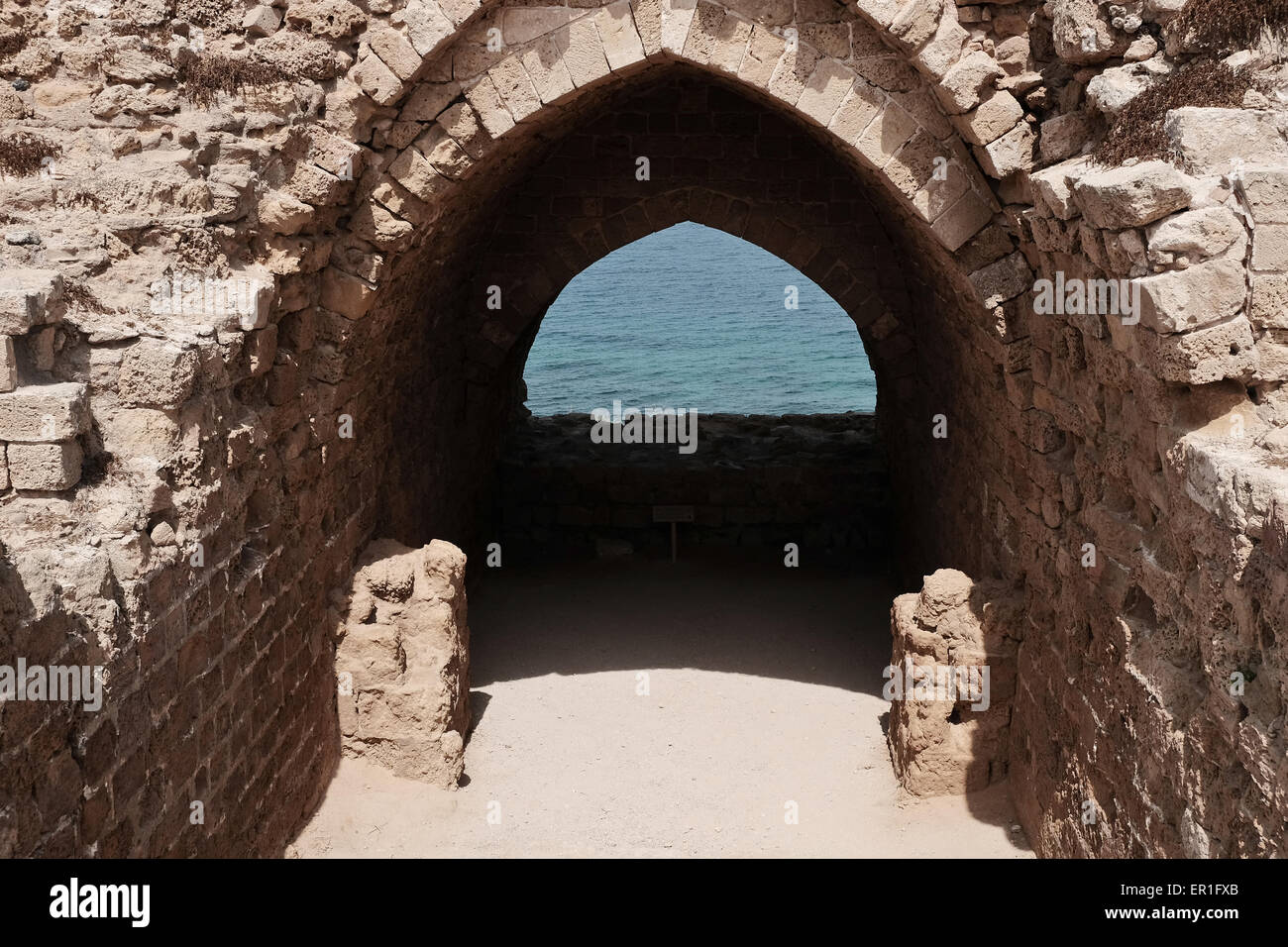 Apollonia National Park, Israel. 24th May, 2015. The Crusader Fortress Arsouf (as named under Crusader rule) was protected by a dry moat and entry was through a wooden bridge. Apollonia National Park, named after the god Apollo, is located on a cliff named Tel Arshaf overlooking the Mediterranean, north of Tel-Aviv. Founded by the Phoenicians in the Persian Period (6th century BCE) it was conquered from the Muslims by the Crusaders in 1191 CE. The fortress was built in 1241 CE dominating the harbor. The Crusader city was walled and surrounded by a moat. Credit:  Nir Alon/Alamy Live News Stock Photo