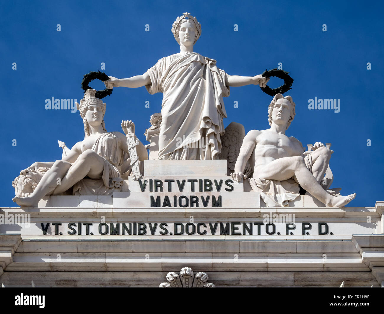 LISBON, PORTUGAL - MARCH 05, 2015:  Statues above the Triumphal Arch in Praca Do Comercio isolated against blue sky Stock Photo