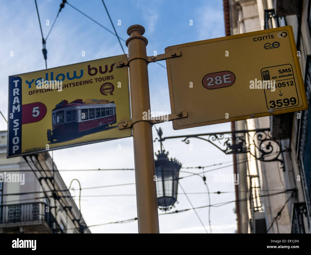 Bus Stop sign for Yellow Bus Tours and 28E Tram Stock Photo