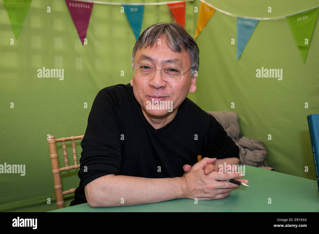 Kazuo Ishiguro signing books at the Hay Festival 2015. Stock Photo