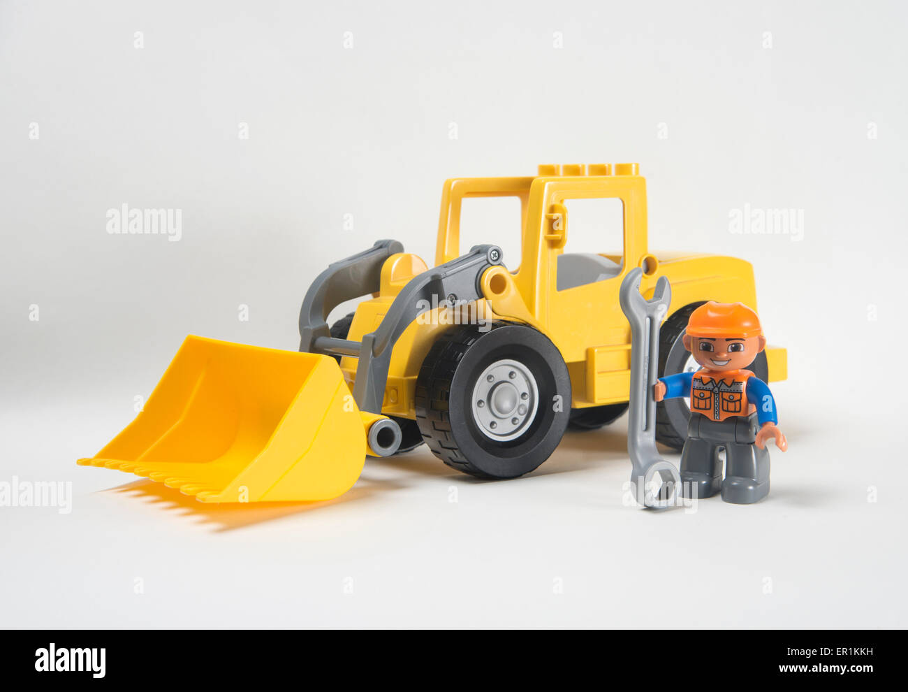 Man at work. Lego Duplo front loader digger with driver holding spanner  Stock Photo - Alamy