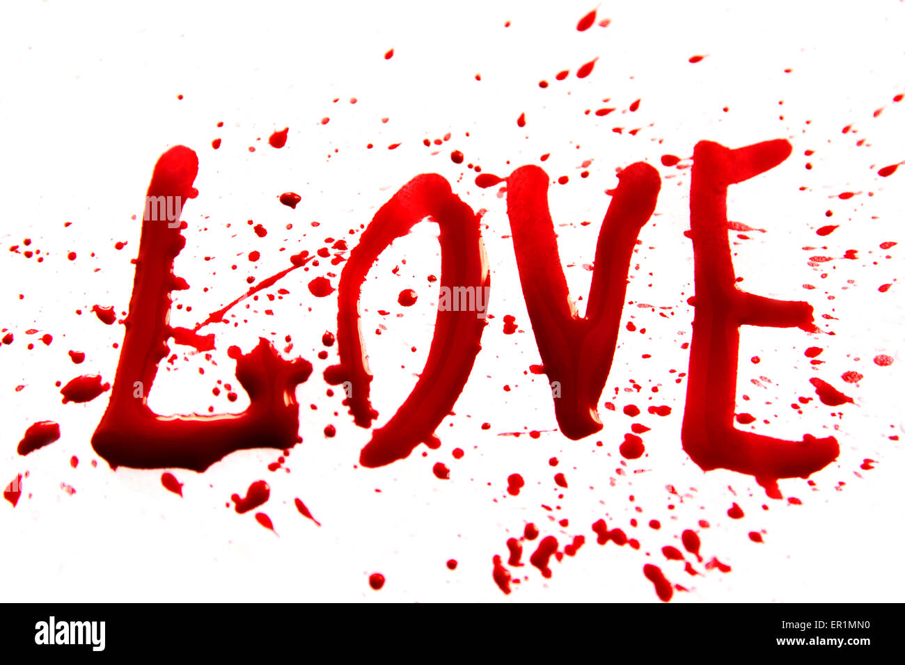 Bloody word Love with splatters, droplets, stains isolated on white background Stock Photo