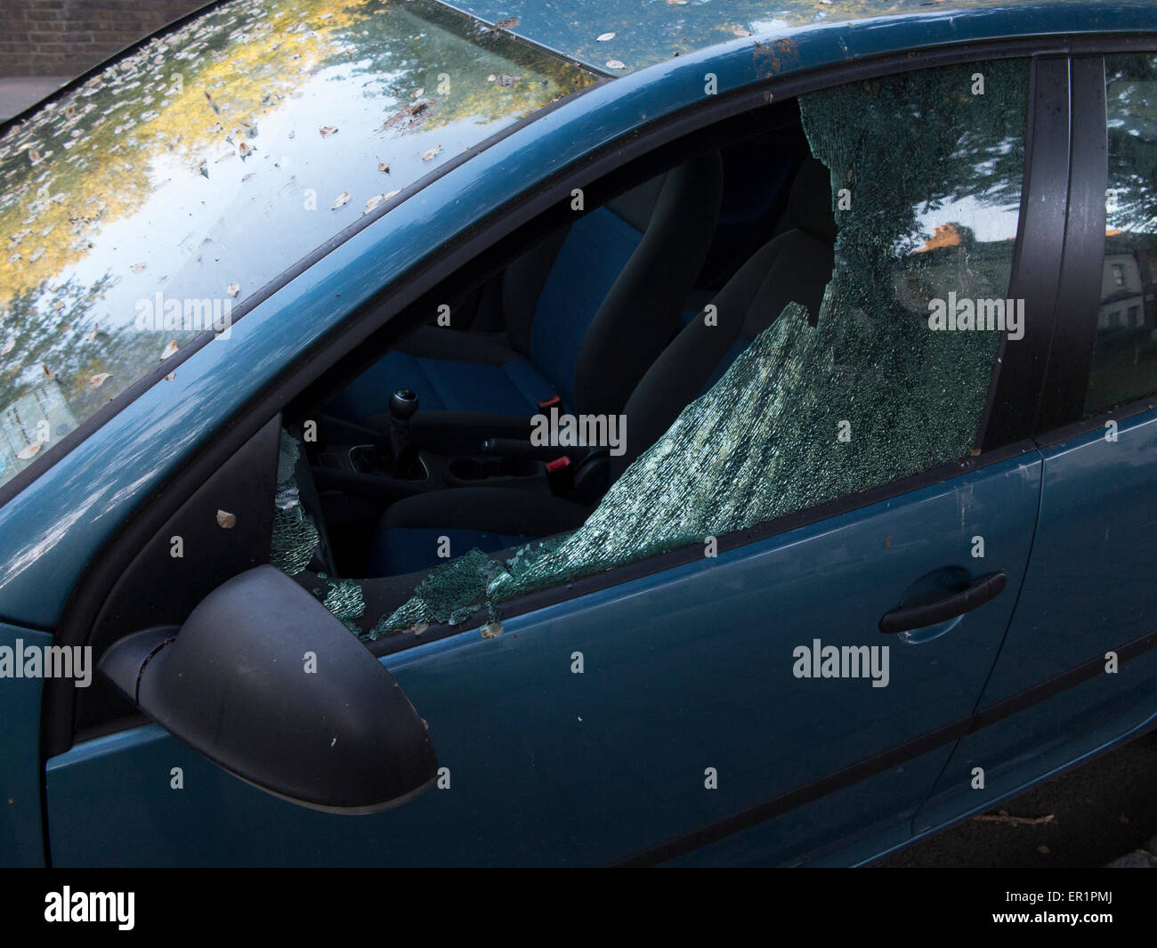 The aftermath of thieves breaking into a car Stock Photo Alamy