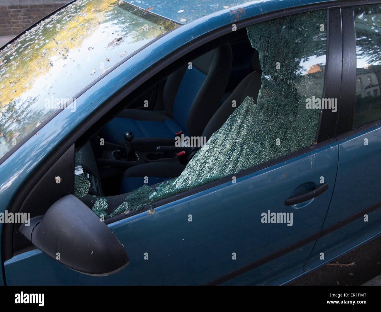 The aftermath of thieves breaking into a car Stock Photo Alamy