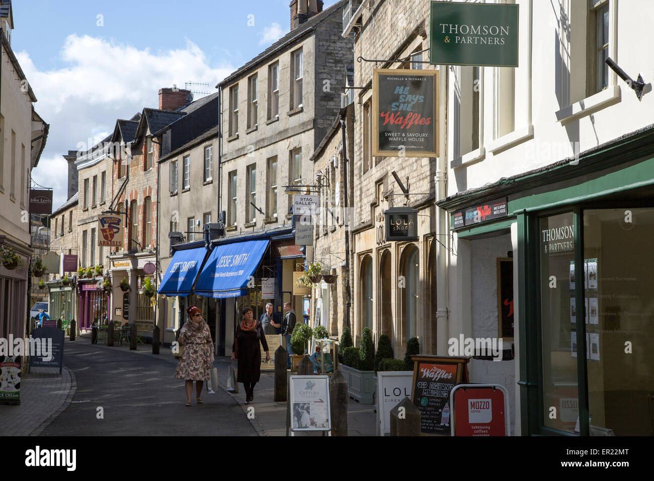 Narrow shopping street in town centre, Cirencester, Gloucestershire, England, UK, Stock Photo