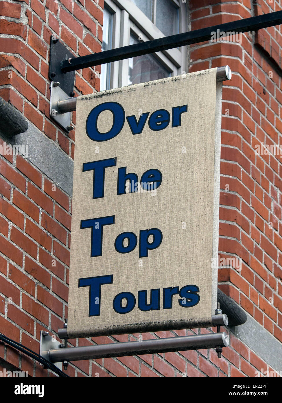 YPRES, BELGIUM - MAY 25, 2014:  Sign above tour shop in Ypres providing battlefield tours of the Flanders battlefields Stock Photo