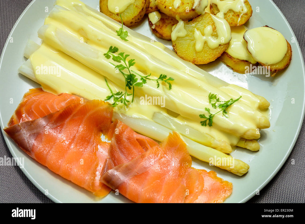 white asparagus and smoke salmon with sauce hollandaise Stock Photo Alamy