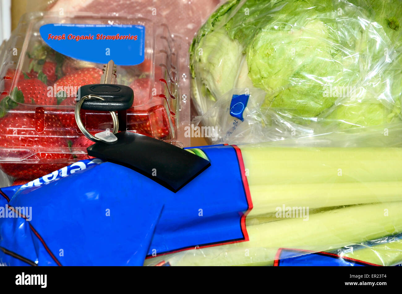 A key left with the produce.  This could be in a store, or a home, a concept for misplacing items and memory loss. Stock Photo