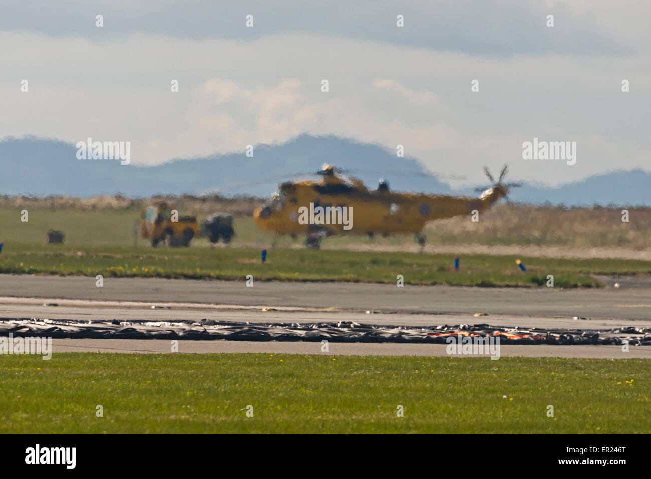 Seaking helicopter heat haze  Raf Valley Anglesey North Wales Uk Stock Photo