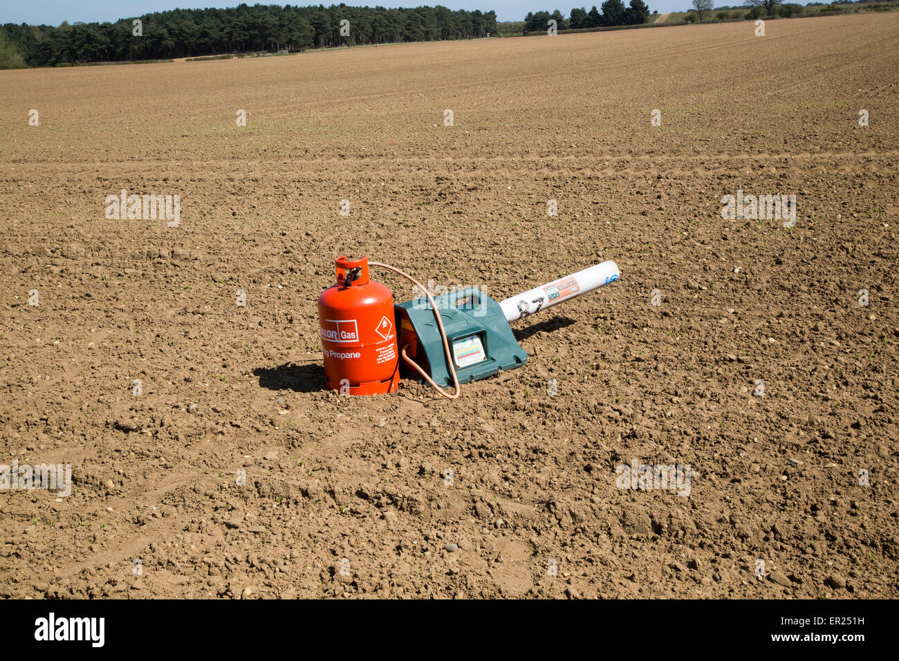 Gas canister bird scarer on farmland, Sutton, Suffolk, England, UK Stock Photo