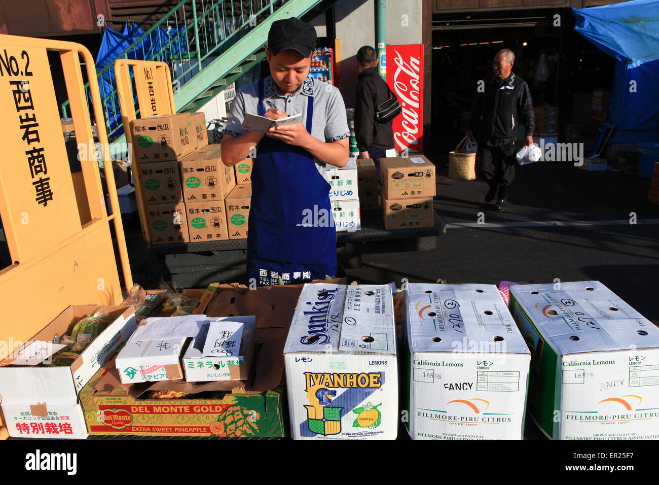 Workers at Famous Tsukiji fish market operational area. Tsukiji is the biggest fish market in the world. Stock Photo