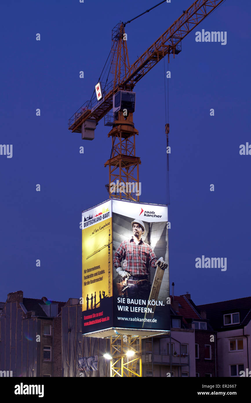 Europa, Deutschland, Nordrhein-Westfalen, Koeln, Baustelle, Kran der Firma Wolff & Mueller mit Werbeplakaten. Der sogenannte Sky Stock Photo