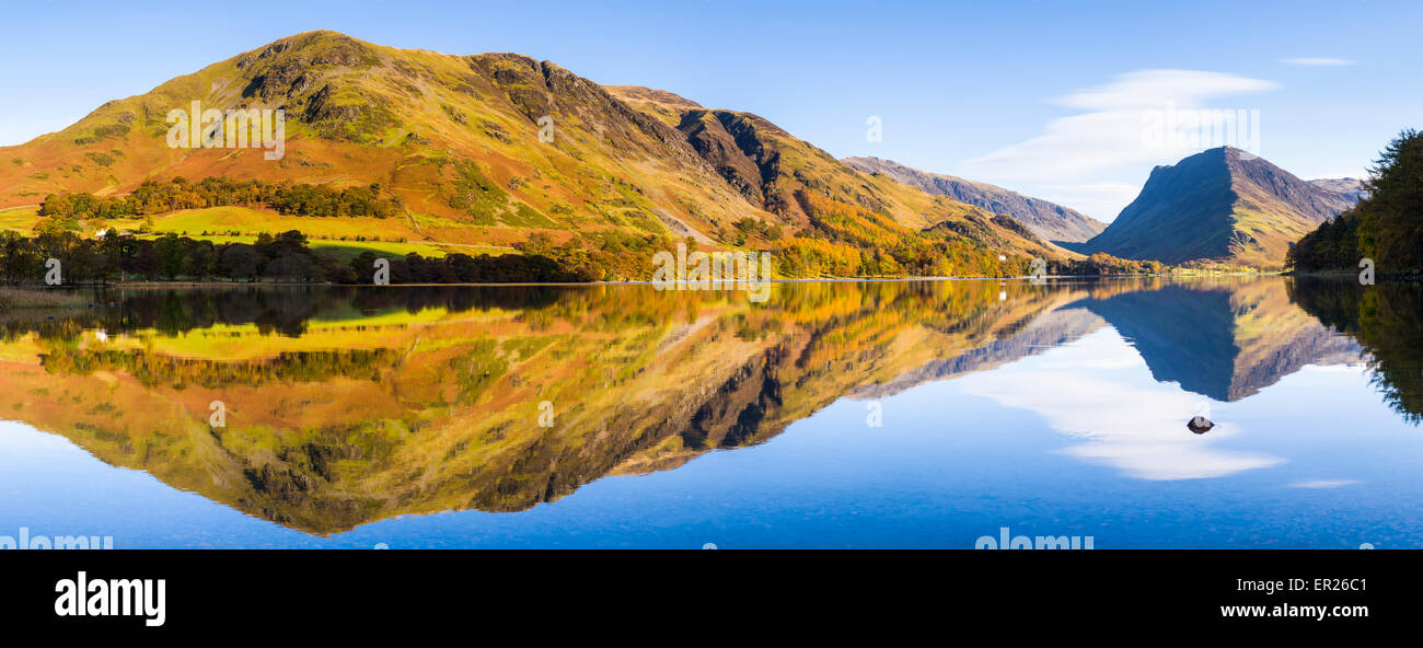 Panorama of High Snockrigg and Robinson fells and Fleetwith Pike reflected in Buttermere lake. Lake District, Cumbria, England. Stock Photo