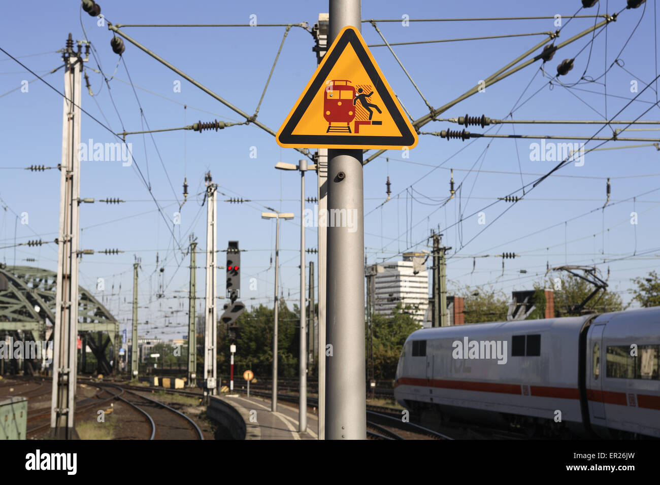 DEU, Germany, Cologne, warning sign for passing trains at the main station.  DEU, Deutschland, Koeln, Warnschild vor vorbeifahre Stock Photo