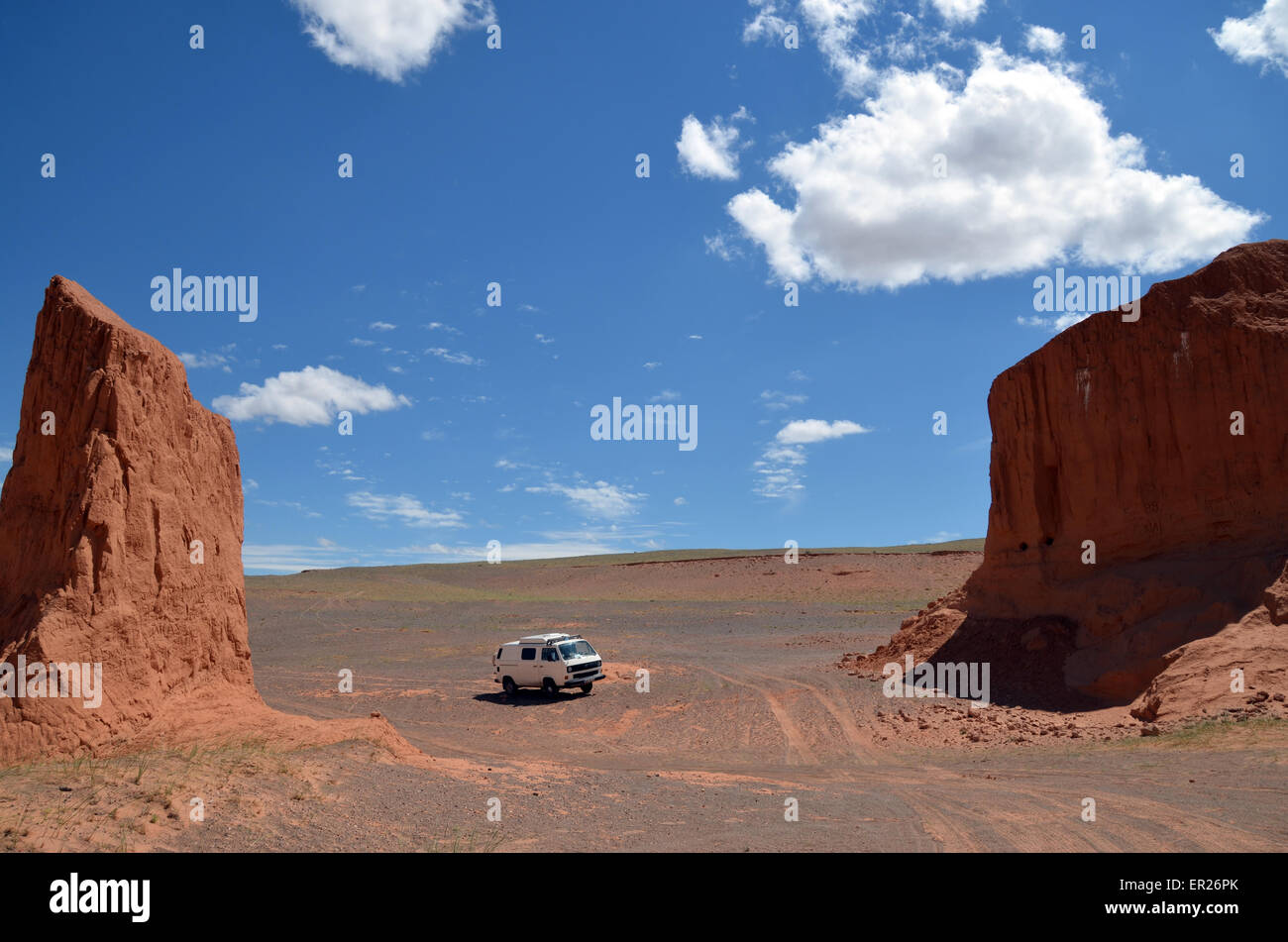 My car at Bayanzag cliffs, also known as flaming cliffs, in the Gobi desert, Omnogovi province, Mongolia. Stock Photo