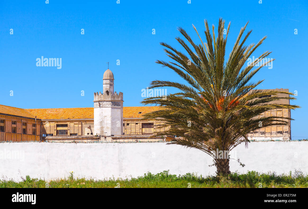 Abandoned buildings with mosque near the avenue Mohammed VI in Tangier city, Morocco Stock Photo