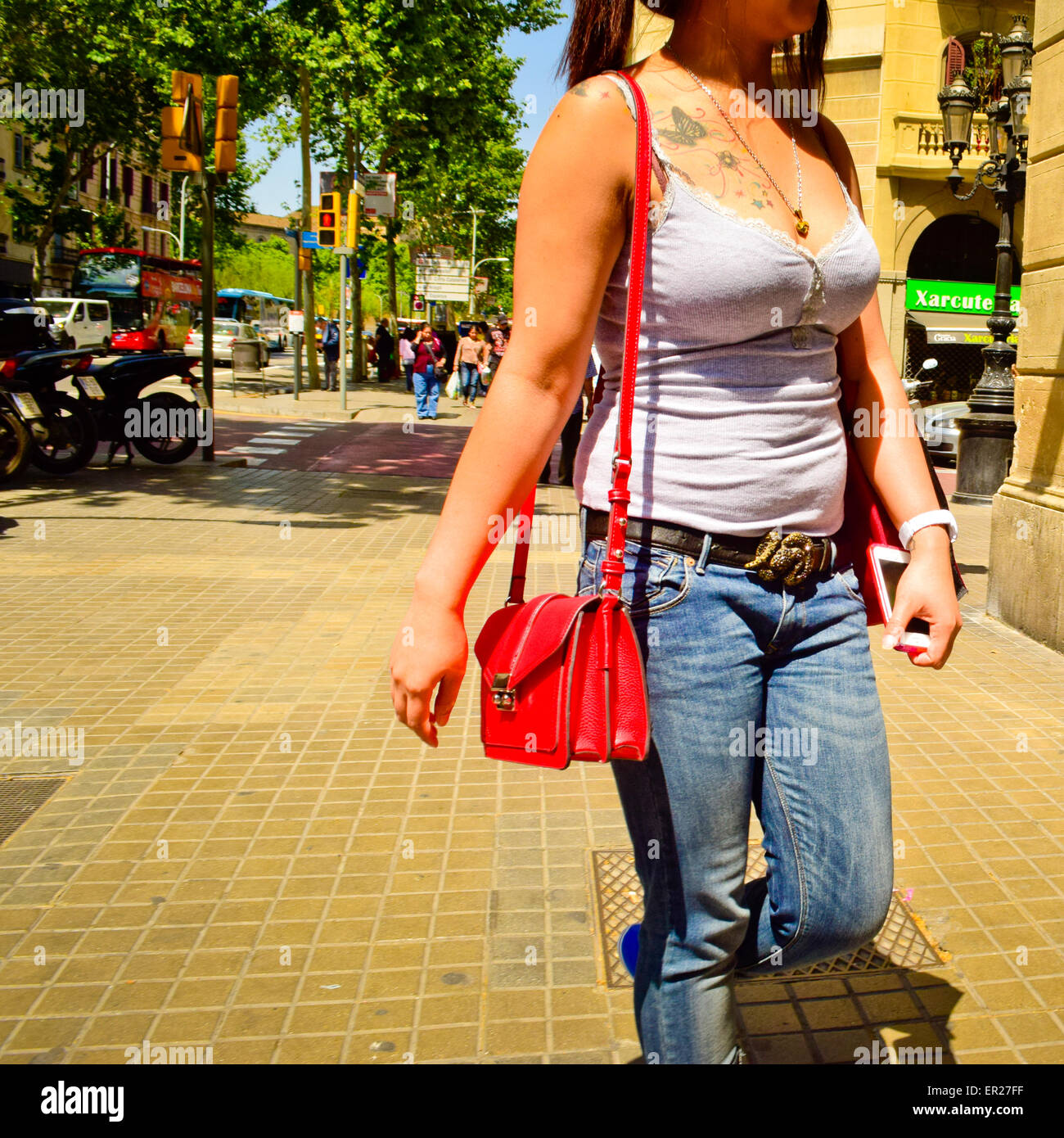 Woman walking along street barcelona hi-res stock photography and ...