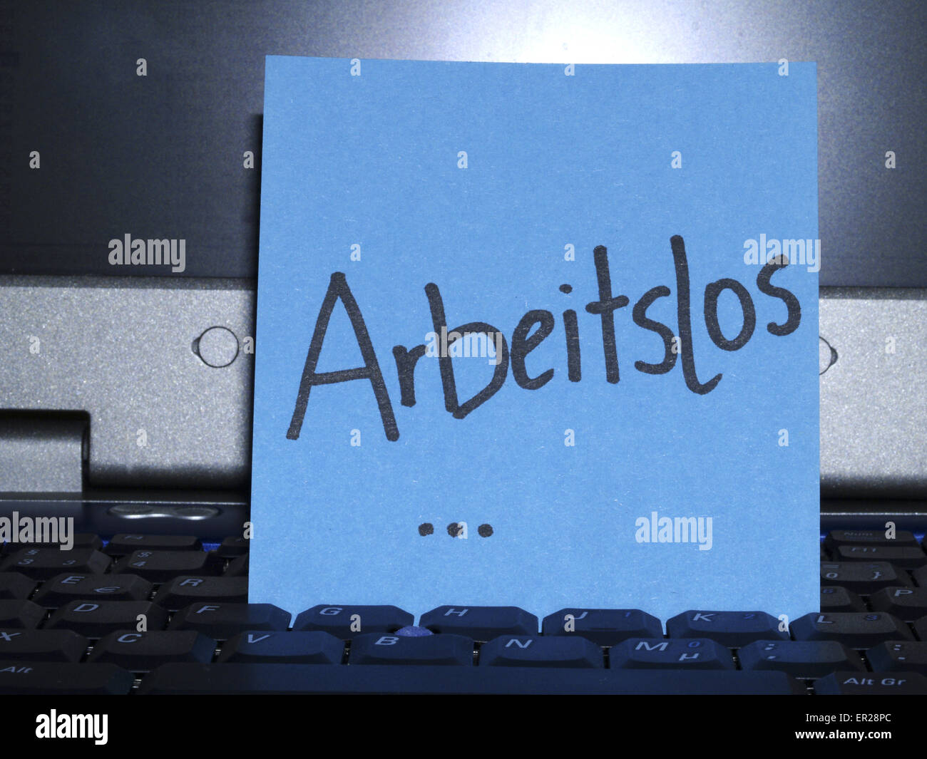 Memo note on notebook, Arbeitslos jobless Stock Photo