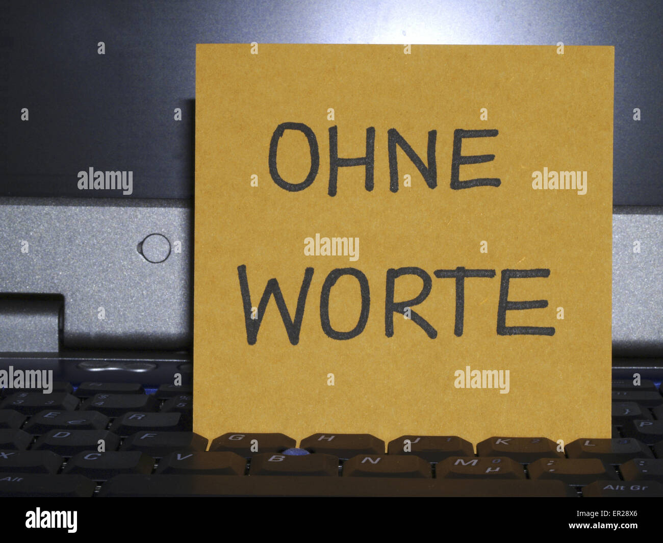 Memo note on notebook, Ohne Worte, without words Stock Photo