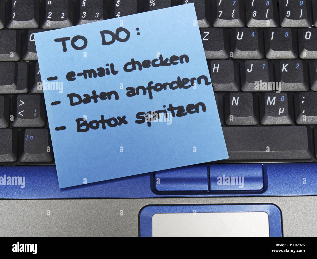 Memo note on notebook, to do e-mail checken, Daten anfordern, Botox spritzen, to do check e-mail, ask for data, inject botox Stock Photo