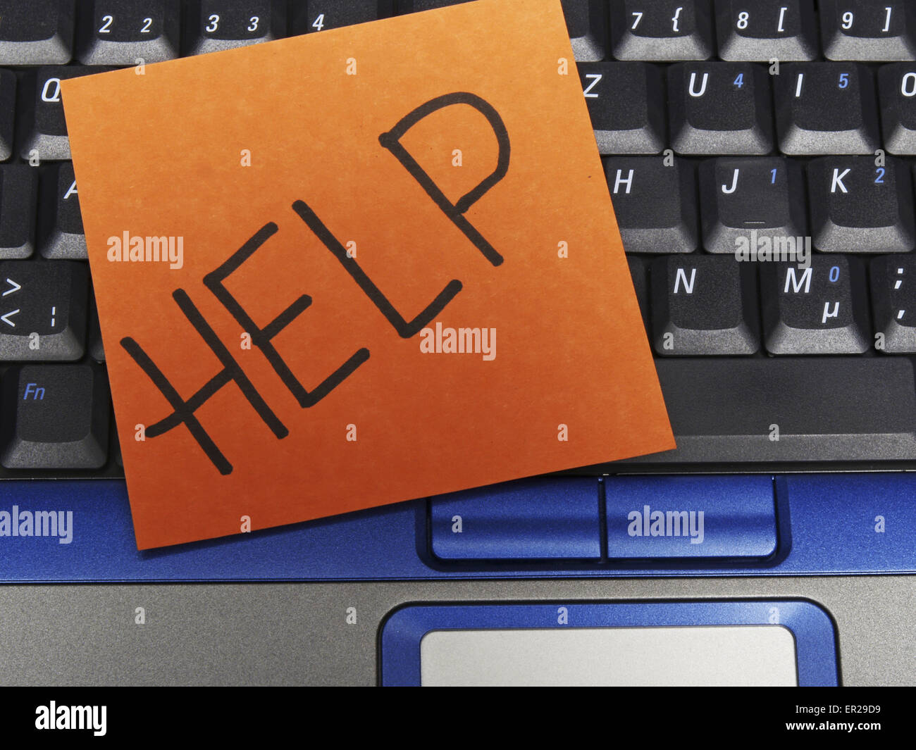 Memo note on notebook, help Stock Photo - Alamy