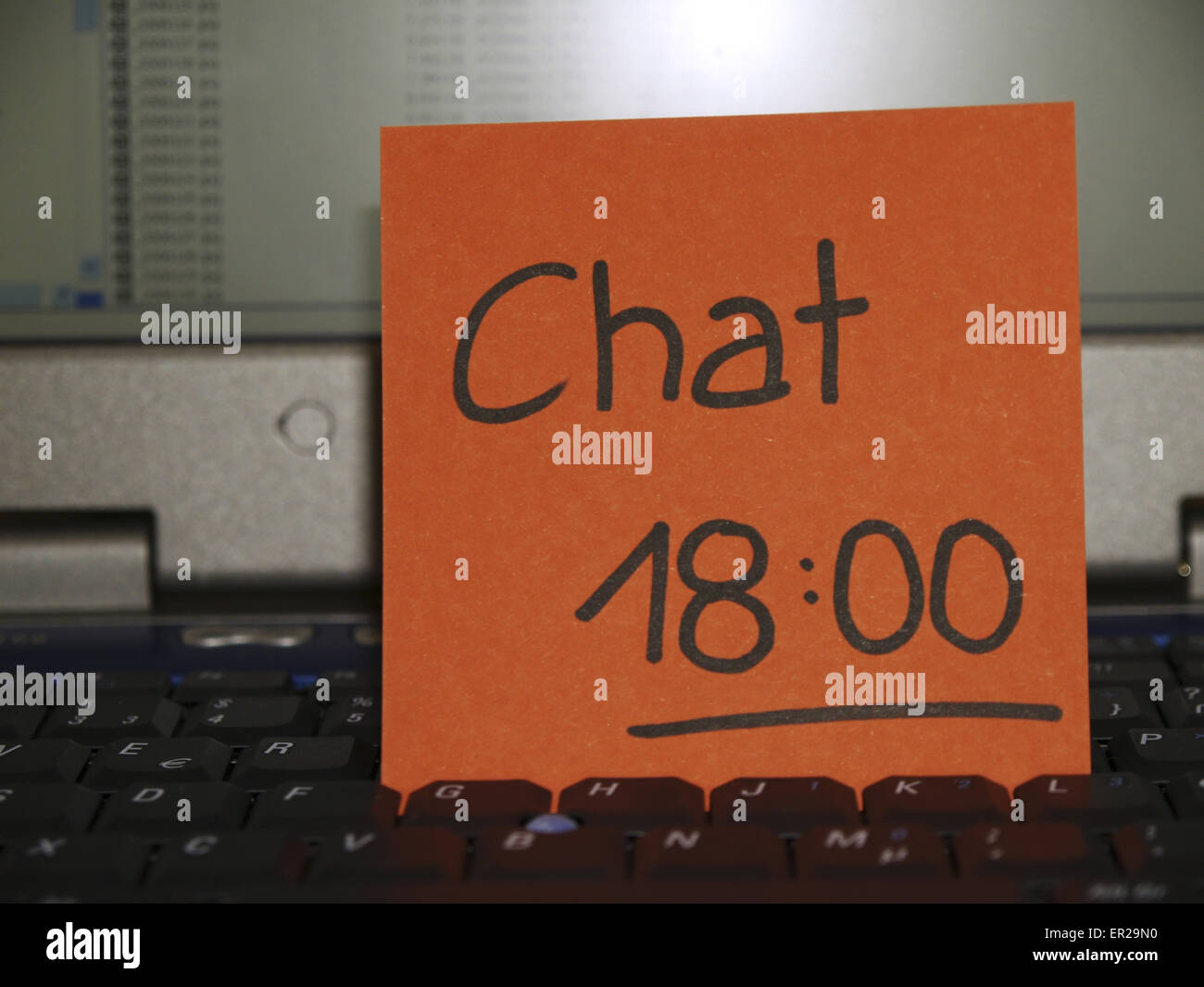 Memo note on notebook, Chat six p.m., chat apointment Stock Photo