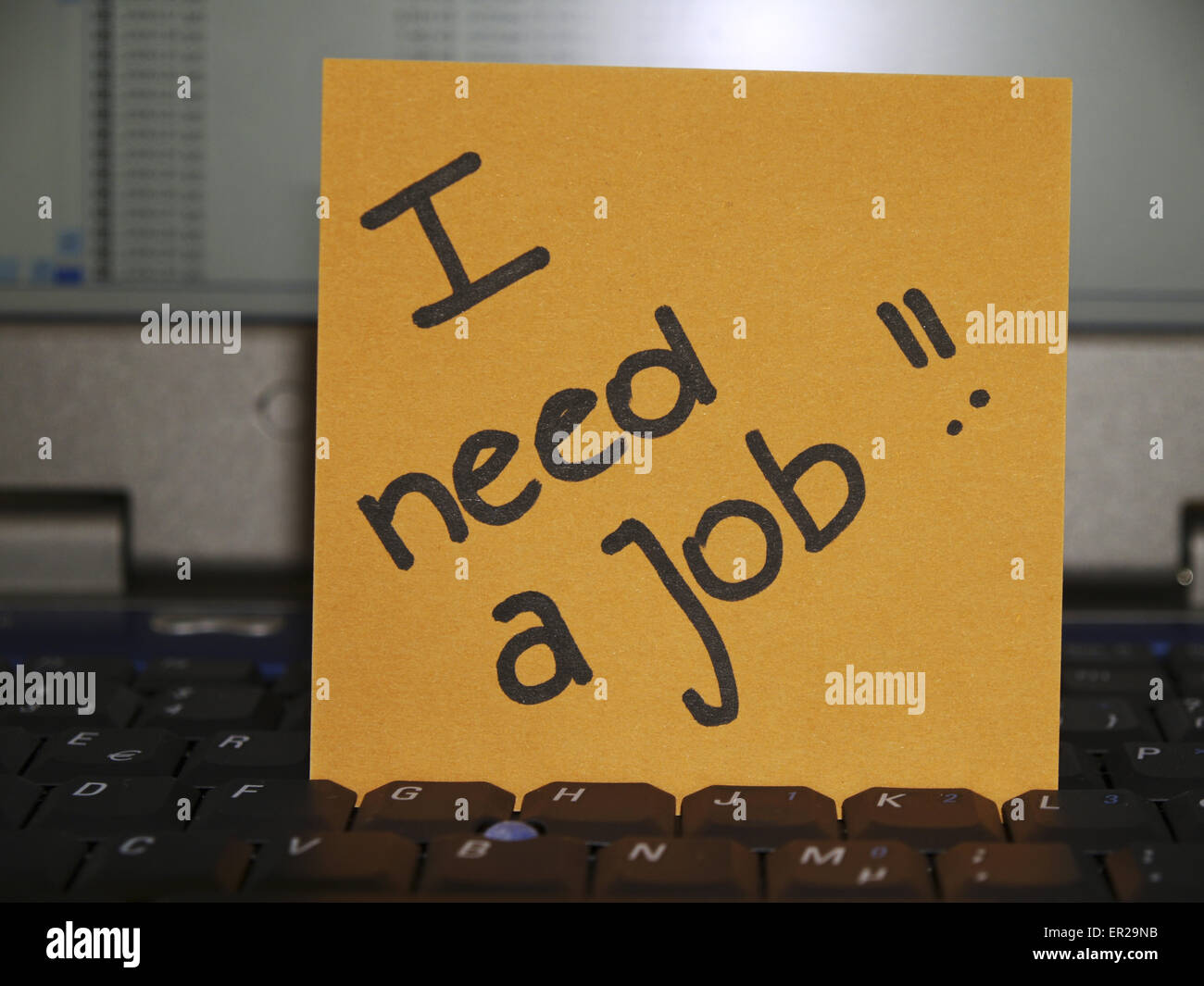 Memo note on notebook, I need a job Stock Photo