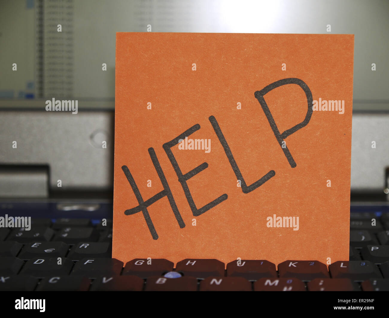 Memo note on notebook, help Stock Photo - Alamy