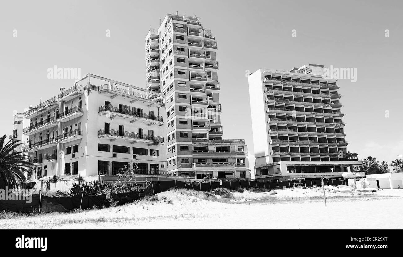 Black and white image of abandoned hotel and apartment blocks on the beach near Famagusta Cyprus. Stock Photo