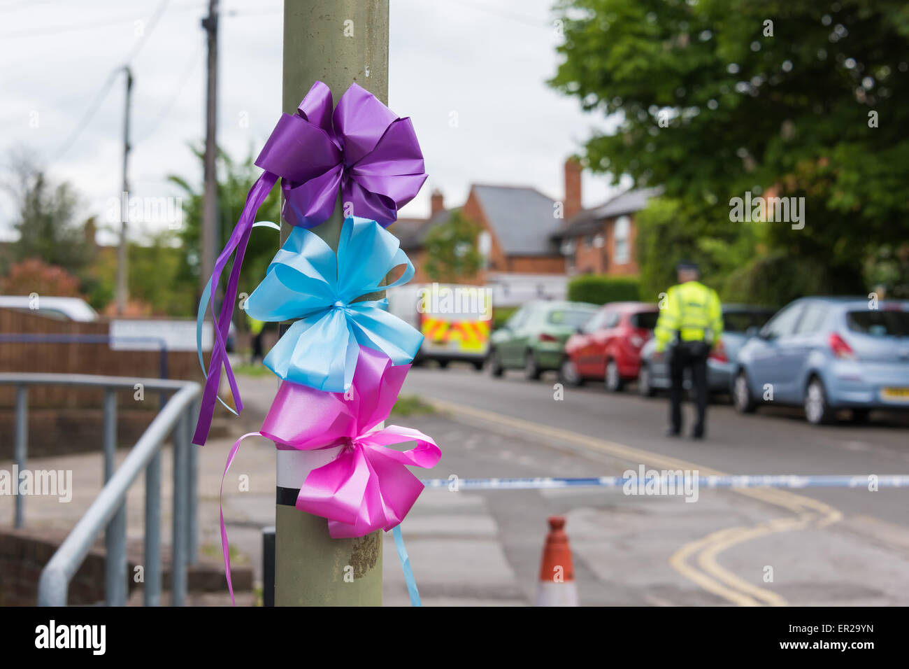 Didcot, Oxfordshire, UK. 25th May, 2015. Colourful ribbons tied to lamp posts/ street lights on Vicarage Road in memory of Mr Howard, Ms Jordon and 6 year old Derin. Credit:  NiKreative/Alamy Live News Stock Photo