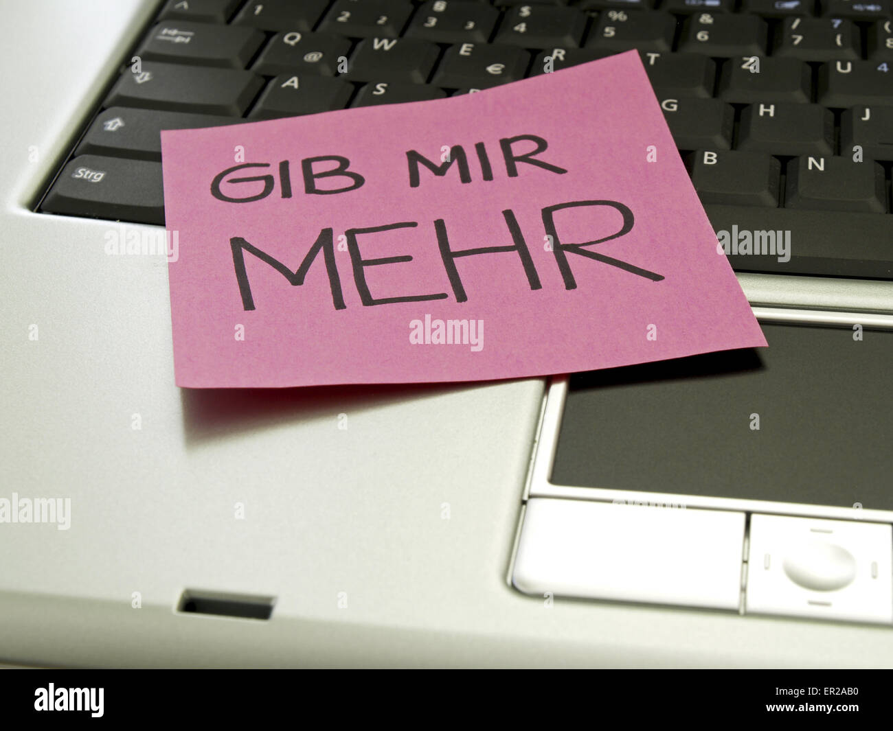 Memo note on notebook, give me more Stock Photo - Alamy