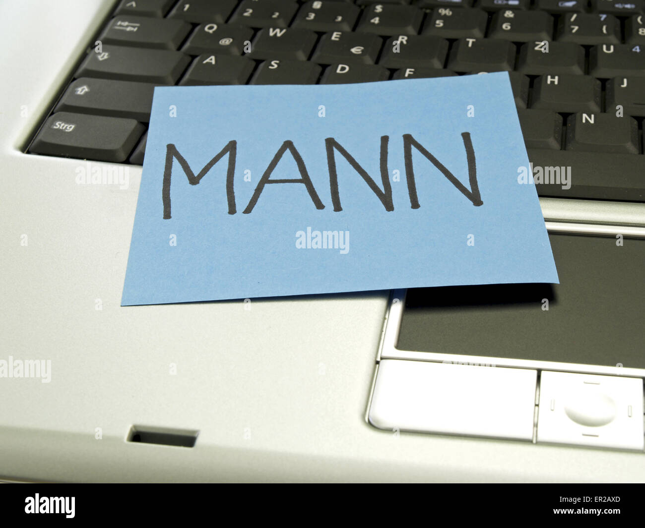 Memo note on notebook, man Stock Photo - Alamy