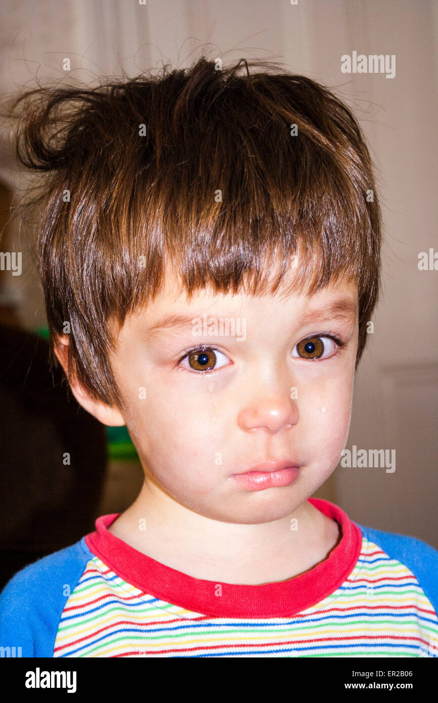 Close up head and shoulder shot of young child, boy, 34 year old