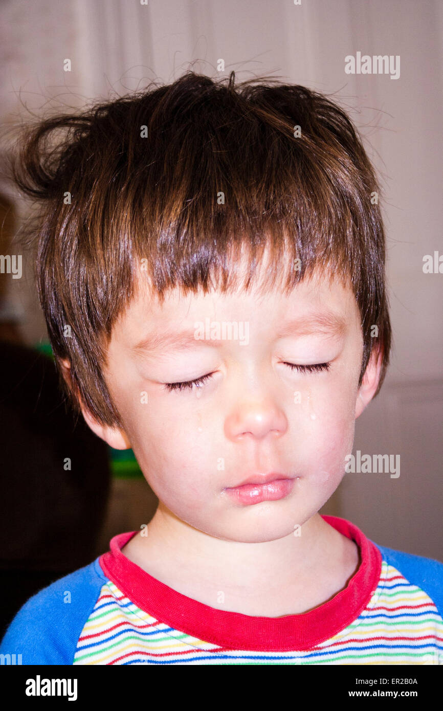 Close up head and shoulder shot of young child, boy, 34 year old
