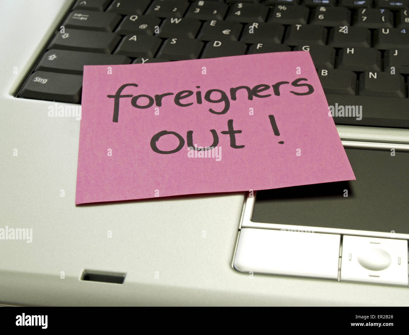 Memo note on notebook, foreigners out Stock Photo - Alamy