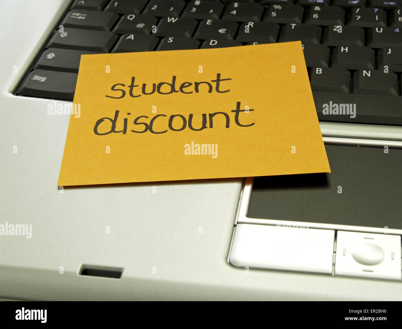Memo note on notebook, student discount Stock Photo Alamy