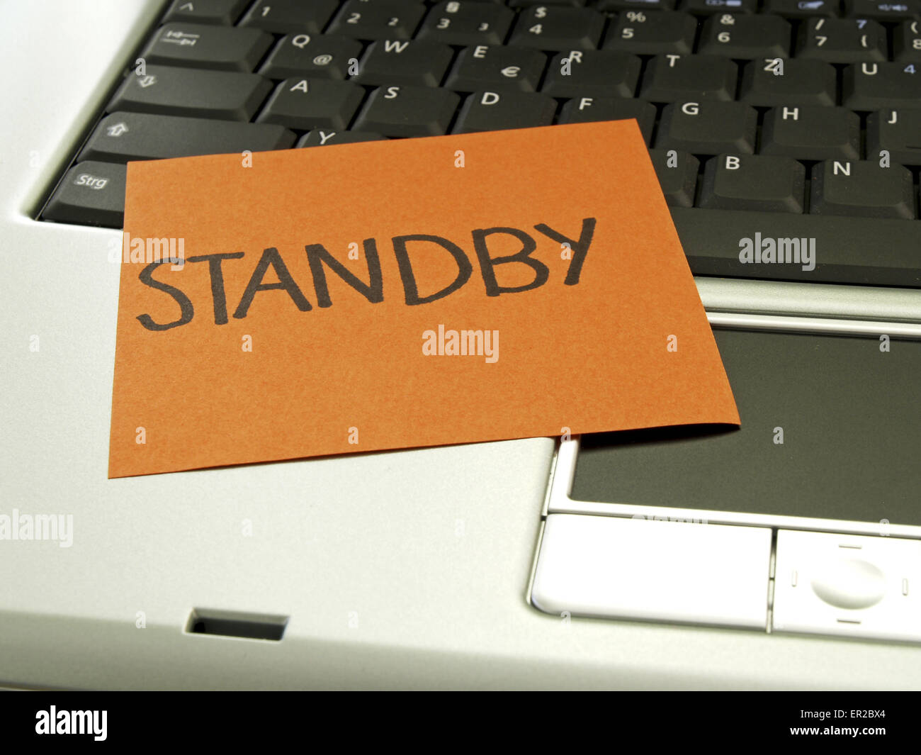 Memo note on notebook, standby Stock Photo Alamy