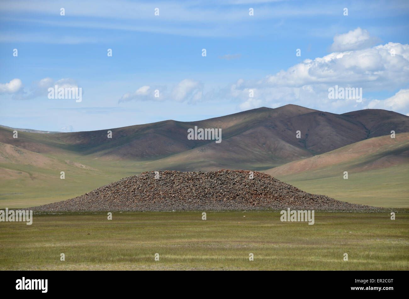 A burial mound in the Arhangay province, central Mongolia. This kind of monument is also called kurgan. Stock Photo