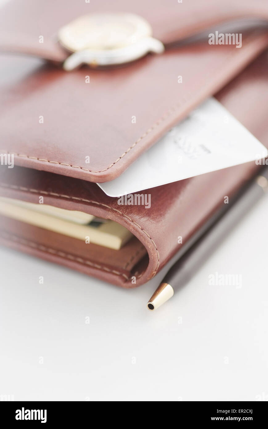 Credit card, pen and a watch on an agenda Stock Photo