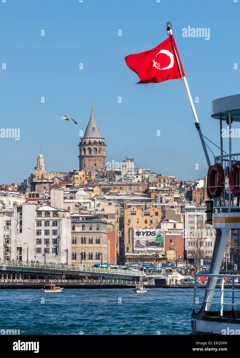 View from Eminonu across the Golden Horn toward Galata bridge with Galata tower and Beyoglu on the Istanbul skyline. Istanbul, T Stock Photo
