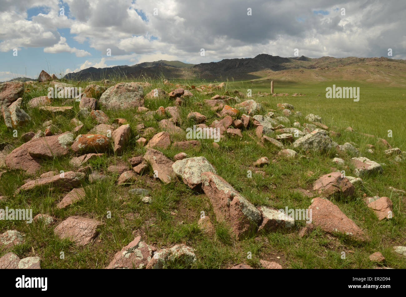 Deer stone and burial mounds near the city of Moron, Ovsgol province, northern Mongolia. Stock Photo
