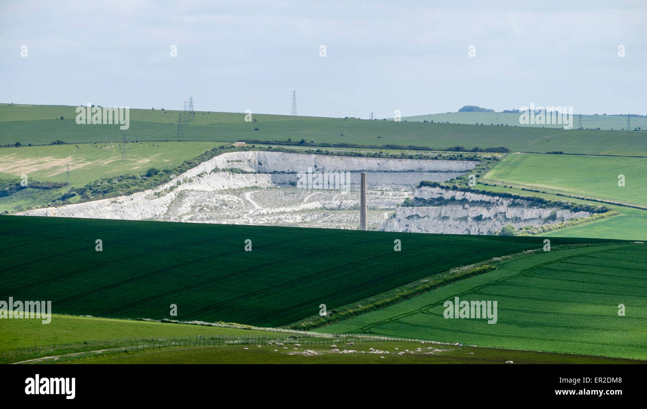 Shoreham Cement Works seen across the downs showing man's harsh work