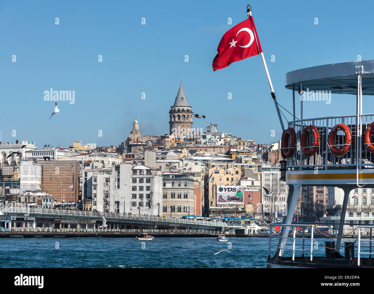 View from Eminonu across the Golden Horn toward Galata bridge with Galata tower and Beyoglu on the Istanbul skyline. Istanbul, T Stock Photo