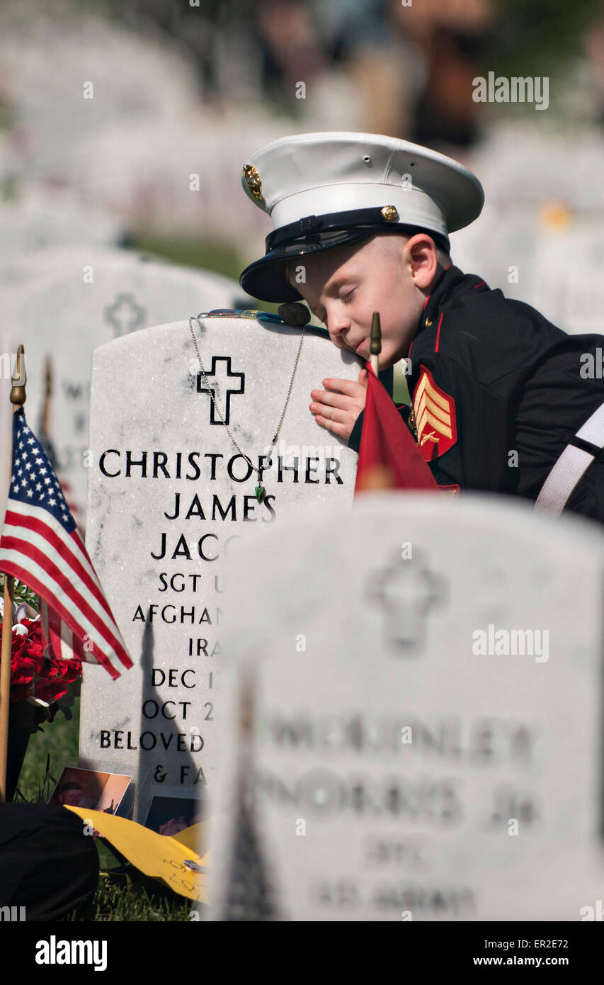 Arlington, Virginia, USA. 25th May, 2015. Christian Jacobs, 4, hugs the headstone of his father  U.S. Marine Corps Sgt. Christopher Jacobs as mother Brittany, wipes away a tear in Arlington National Cemetery on Memorial Day May 25, 2015 in Arlington, Virginia. Credit:  Planetpix/Alamy Live News Stock Photo
