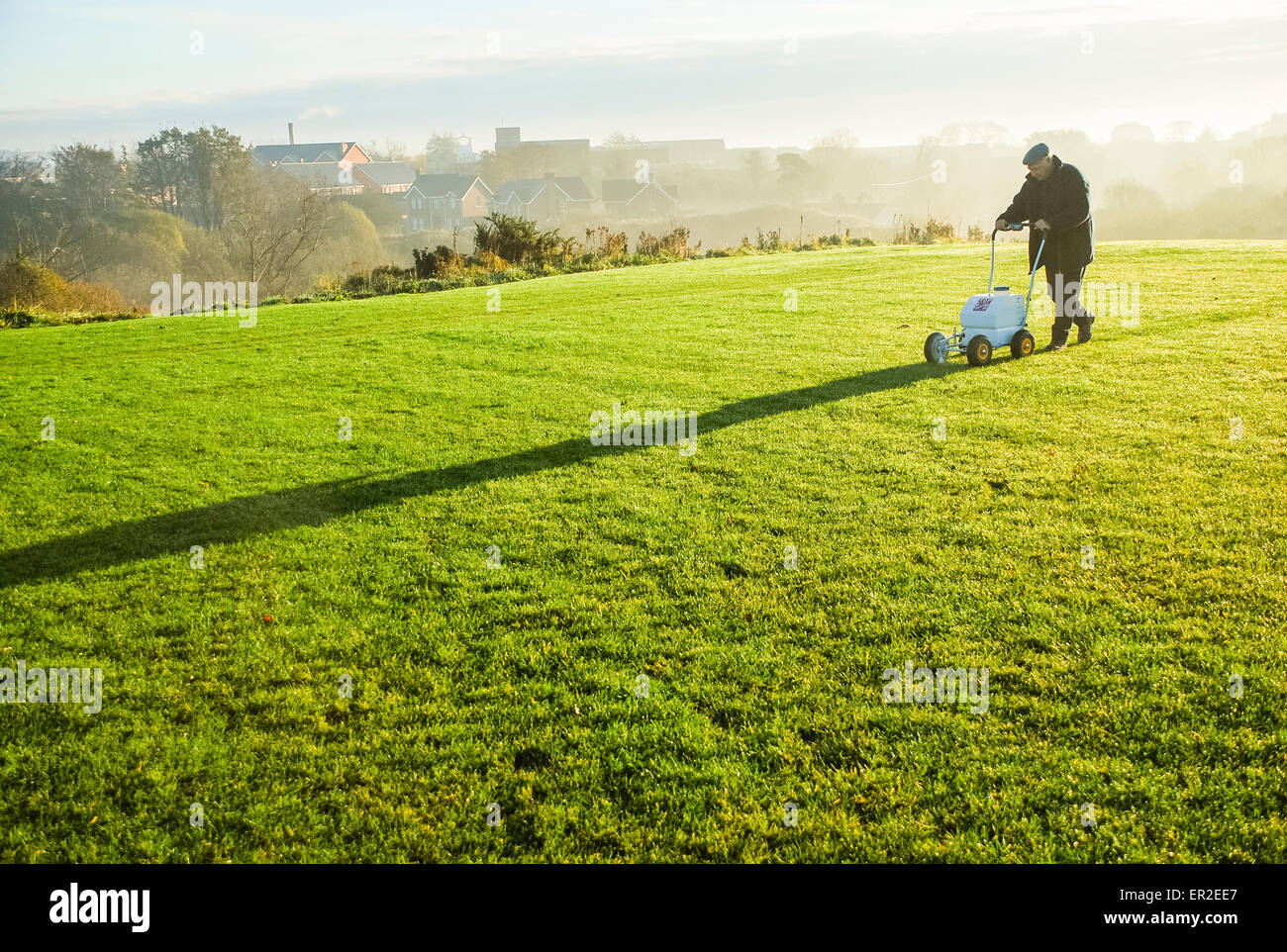 A man marks out lines on a football pitch Stock Photo Alamy