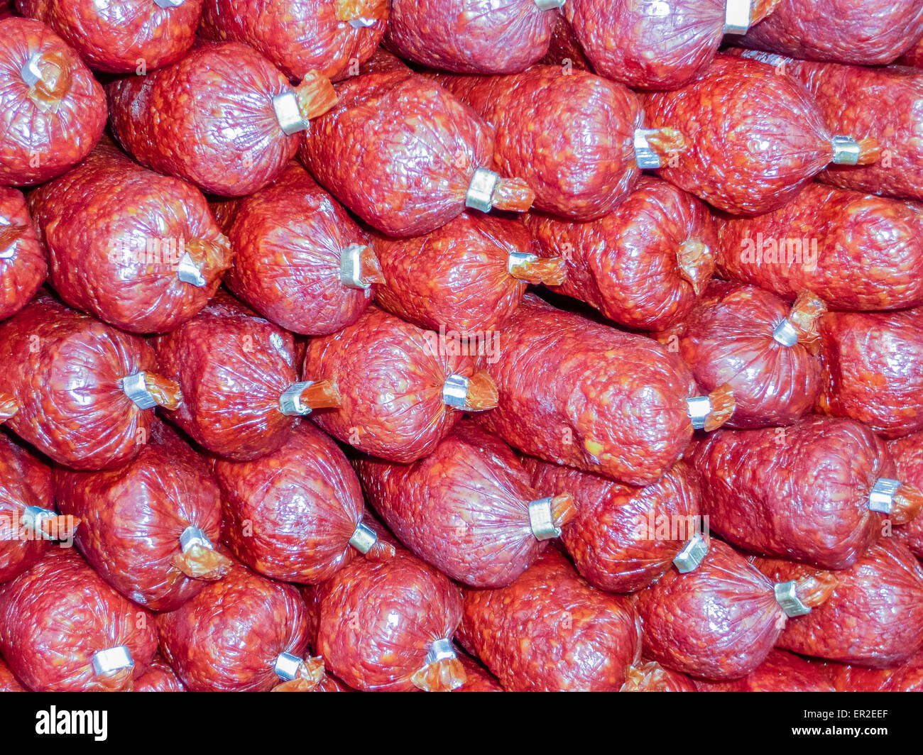 Salamis piled up in a shop Stock Photo Alamy