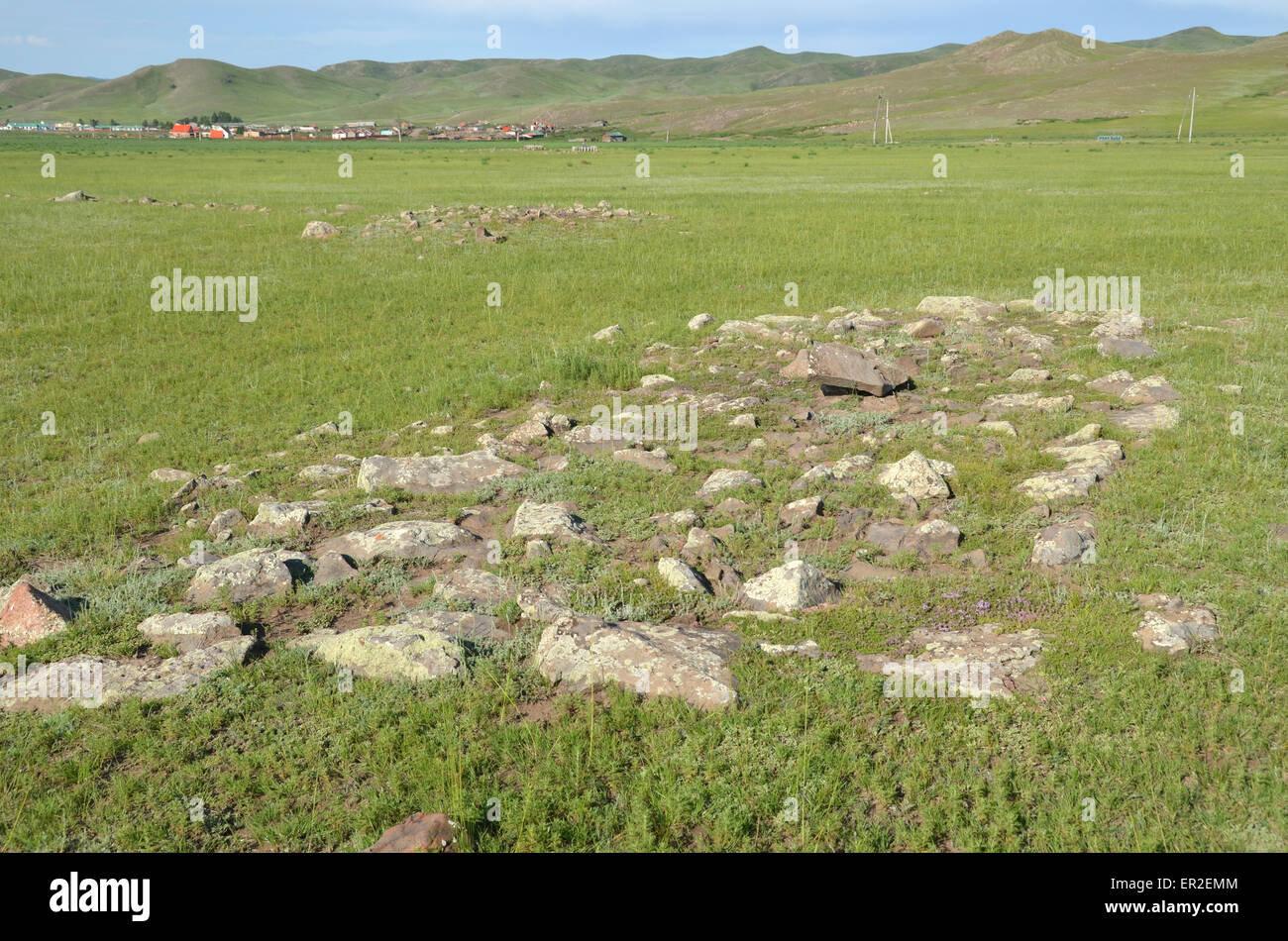 Burial mounds in the village of Orkhon, Bulgan province, Mongolia. Deer stones are antic monuments. Stock Photo